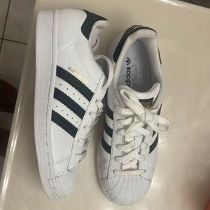 Womens adidas Shell toe shoes.